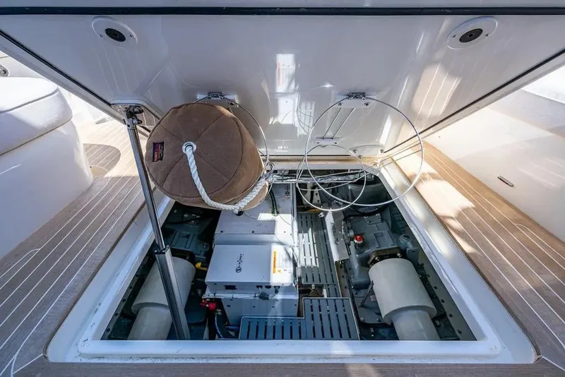 Slide: The Image of Engine compartment of 2021 Hinckley Talaria 55 Flybridge MKII yacht, showcasing mechanical components. - 27
