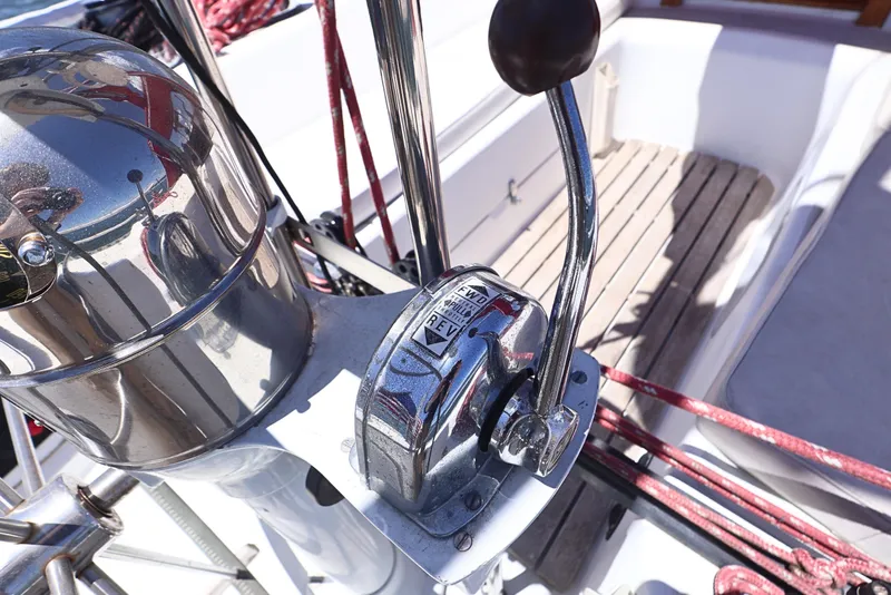 Slide: The Image of Cockpit controls of a 1989 J Boat J 40 sailboat, featuring throttle and compass. - 10