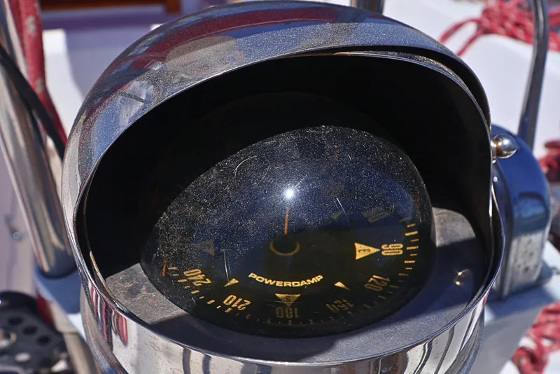 Slide: The Image of Close-up of a compass on a 1989 J Boat J 40 sailboat. - 12