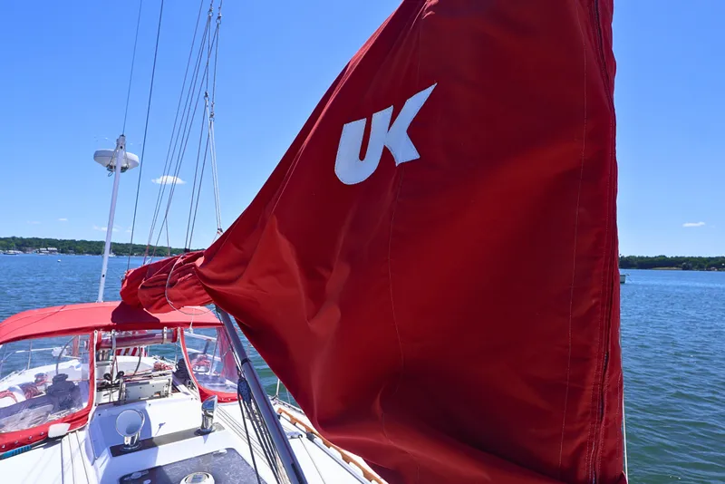 Slide: The Image of Red sail on 1989 J Boat J 40, sailing on a sunny day. - 14