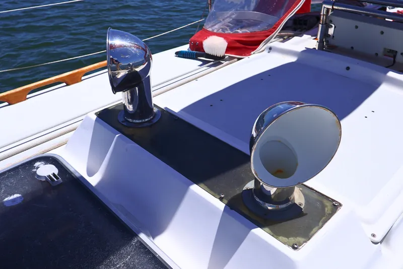 Slide: The Image of 1989 J Boat J 40 deck with chrome vents and ocean backdrop. - 17