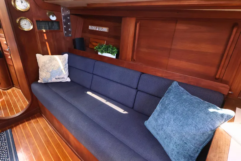 Slide: The Image of Interior of 1989 J Boat J 40 with blue sofa and nautical decor. - 27