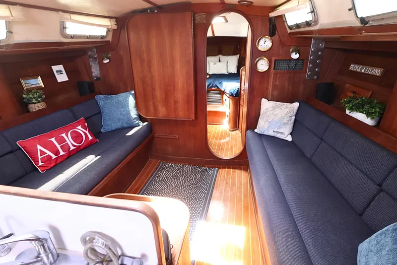 Slide: The Image of Cozy interior of 1989 J Boat J 40 sailboat with wooden finish and nautical decor. - 28