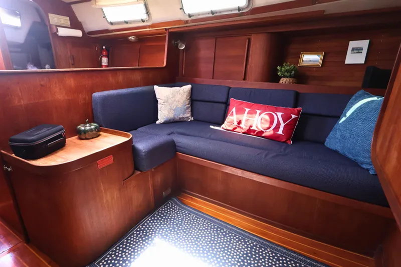 Slide: The Image of Cozy interior of 1989 J Boat J 40 with blue seating and nautical decor. - 29