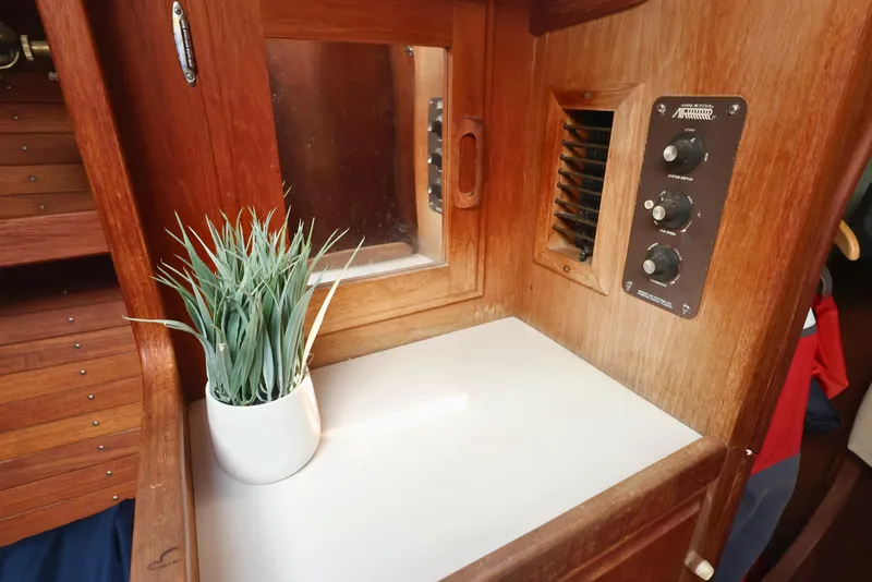 Slide: The Image of Interior of 1989 J Boat J 40 with wooden paneling and potted plant. - 37