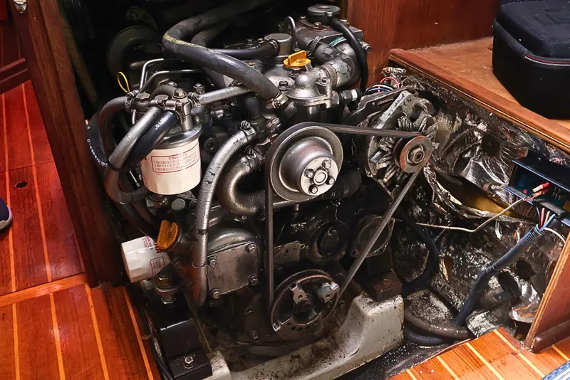 Slide: The Image of Engine compartment of a 1989 J Boat J 40, showcasing mechanical components and wiring. - 45