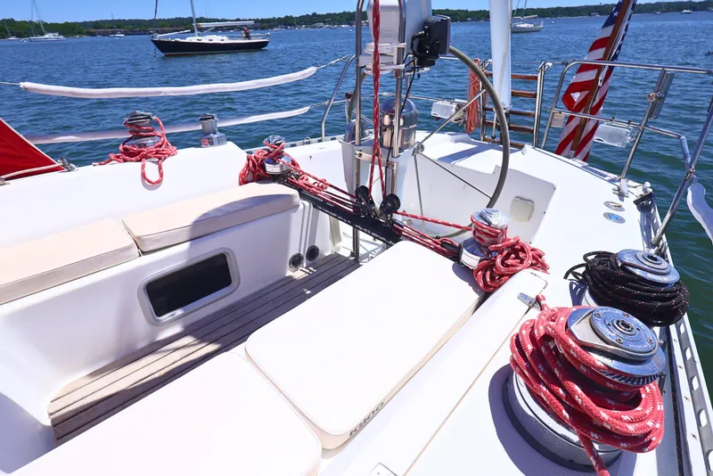 Slide: The Image of Cockpit of 1989 J Boat J 40 sailboat with ropes and winches, docked on a sunny day. - 7