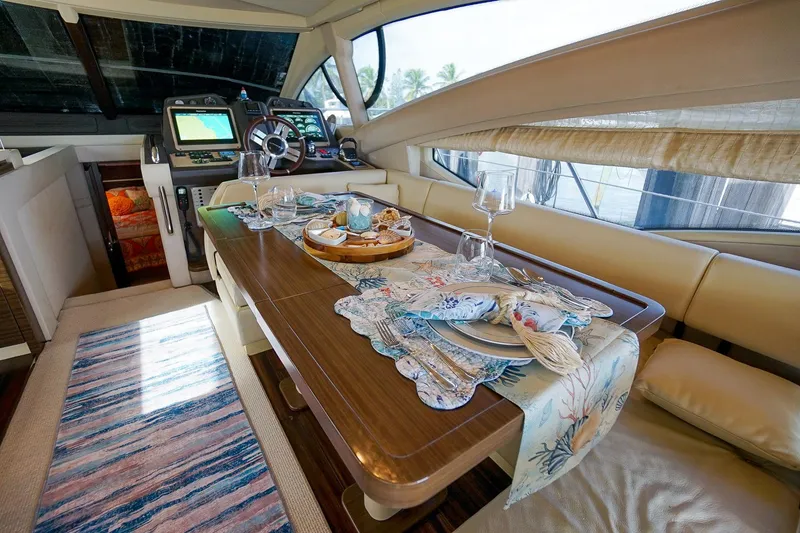 Slide: The Image of Luxurious interior of 2014 Azimut 54 Flybridge yacht with elegant dining setup. - 33