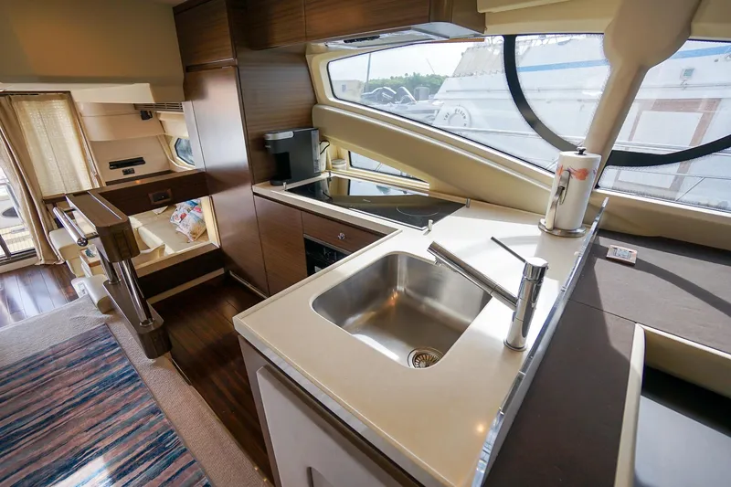 Slide: The Image of Luxurious interior of 2014 Azimut 54 Flybridge yacht with modern kitchen and seating area. - 36