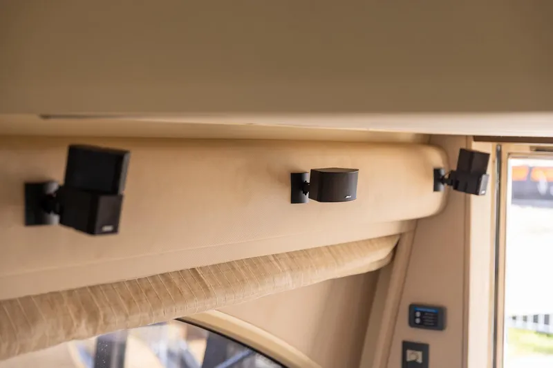 Slide: The Image of Interior speakers on 2014 Azimut 54 Flybridge yacht, mounted on beige wall. - 60