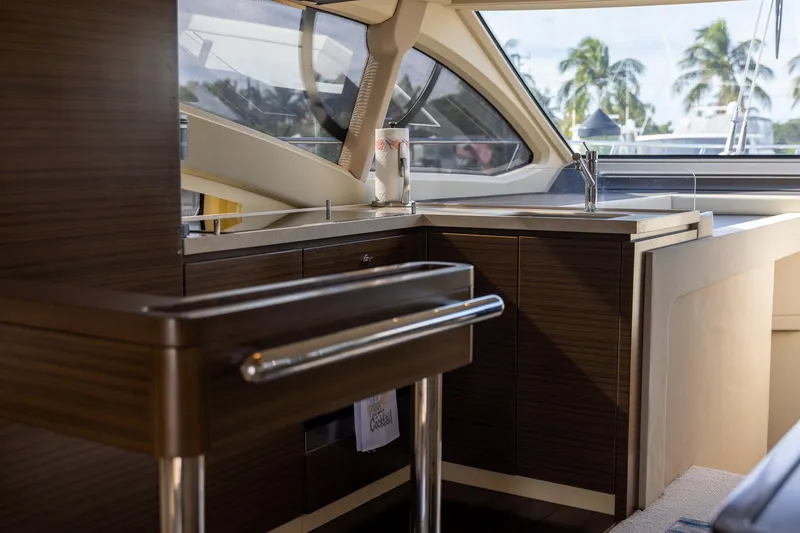 Slide: The Image of Luxurious interior of 2014 Azimut 54 Flybridge yacht with modern kitchen and scenic view. - 62