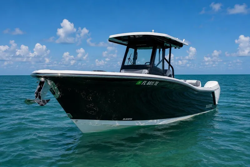 The Image of 2021 Blackfin 272 CC boat on clear blue ocean under a sunny sky. - 0