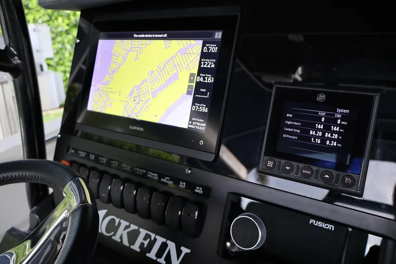 Slide: The Image of Dashboard of a 2021 Blackfin 272 CC boat with Garmin navigation display. - 12