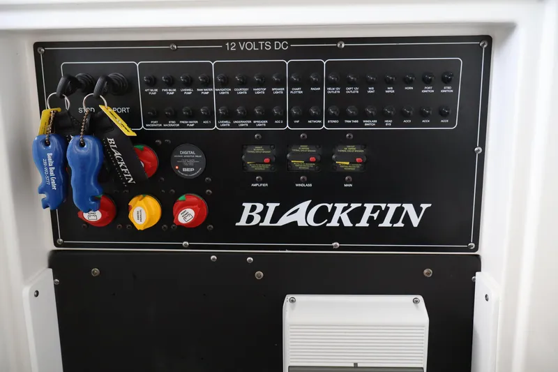Slide: The Image of Control panel of a 2021 Blackfin 272 CC boat with labeled switches and keys. - 15