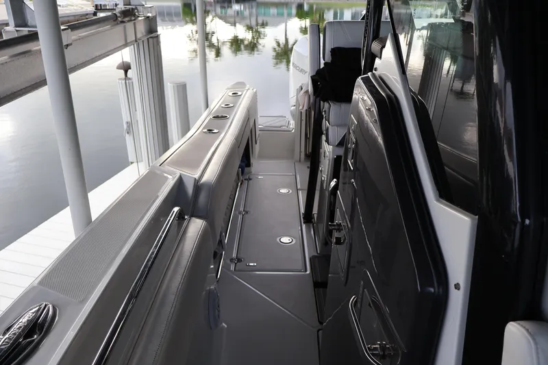 Slide: The Image of Interior view of 2021 Blackfin 272 CC boat, showcasing sleek design and seating area. - 17