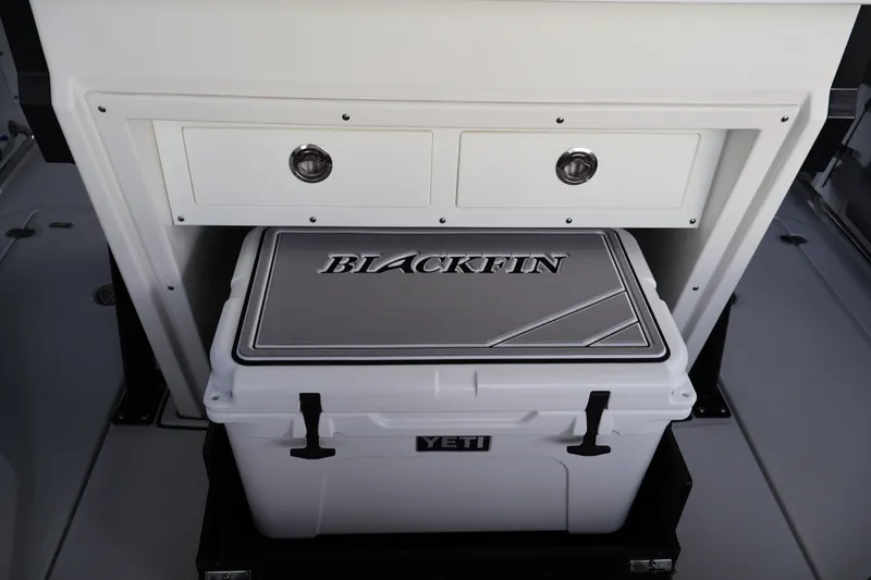 Slide: The Image of 2021 Blackfin 272 CC boat interior with Yeti cooler and storage drawers. - 19