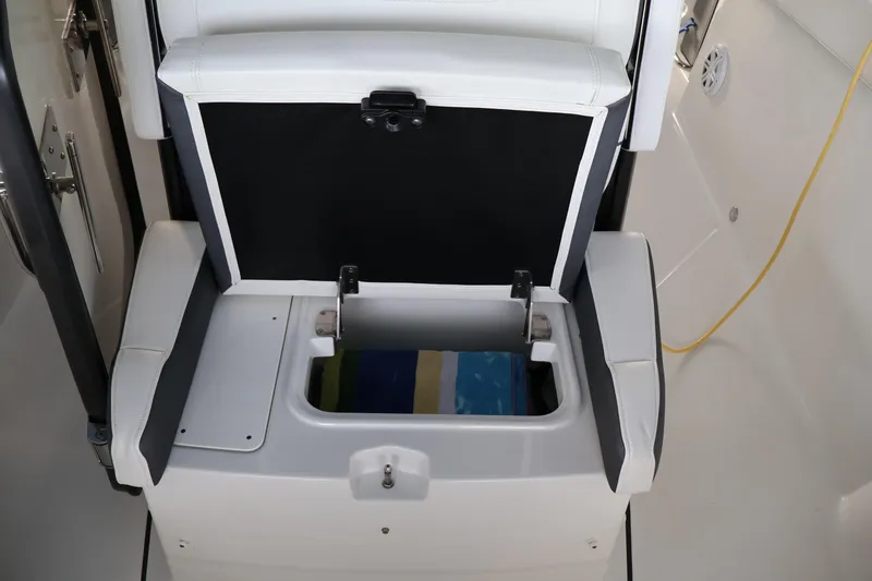 Slide: The Image of 2021 Blackfin 272 CC boat seat with open storage compartment. - 24