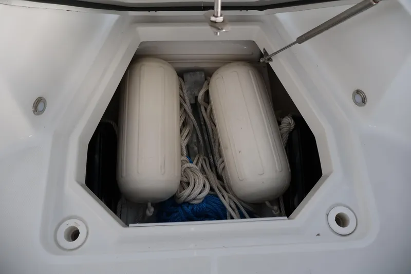 Slide: The Image of Storage compartment of 2021 Blackfin 272 CC boat with fenders and ropes. - 25