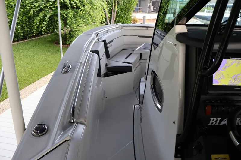 Slide: The Image of 2021 Blackfin 272 CC boat interior with seating and navigation display. - 29