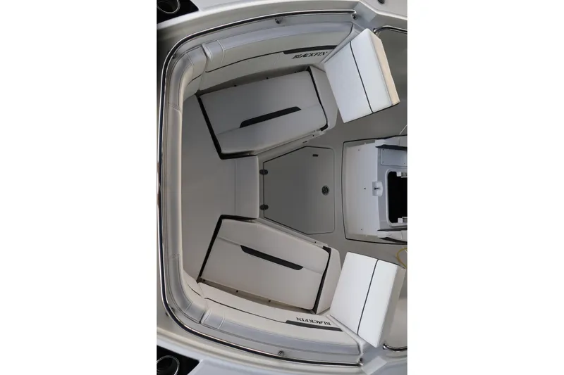 Slide: The Image of Interior view of 2021 Blackfin 272 CC boat, showcasing seating and storage layout. - 39