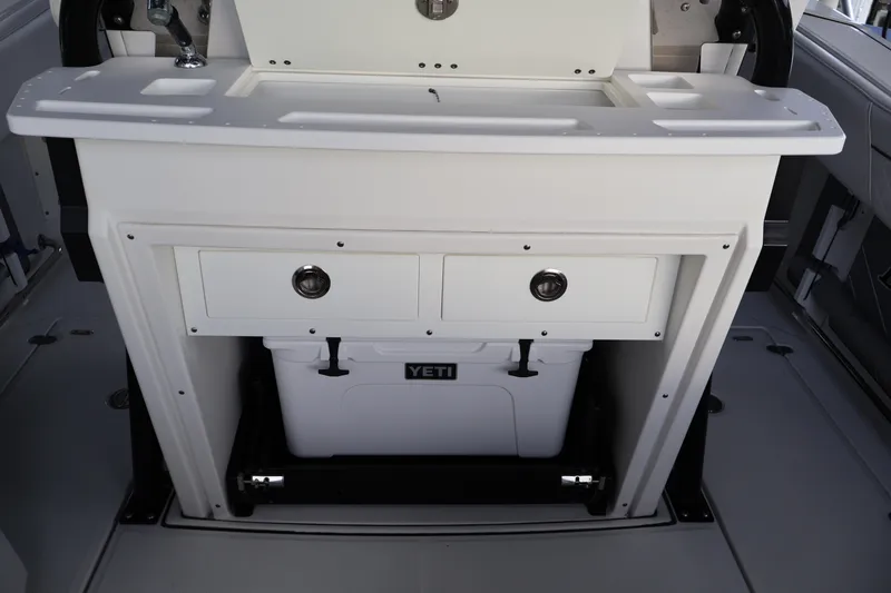 Slide: The Image of 2021 Blackfin 272 CC boat interior with storage drawers and Yeti cooler. - 18