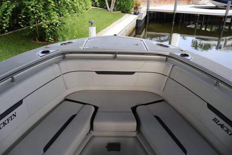 Slide: The Image of 2021 Blackfin 272 CC boat interior with cushioned seating and sleek design. - 27
