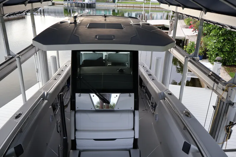 Slide: The Image of 2021 Blackfin 272 CC boat docked, showcasing sleek design and spacious interior. - 30