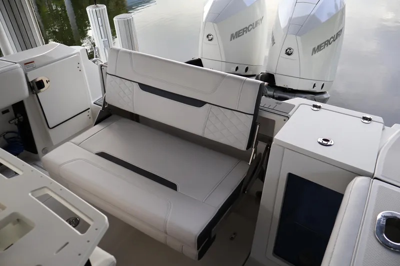 Slide: The Image of 2021 Blackfin 272 CC boat interior with seating and dual Mercury engines. - 36