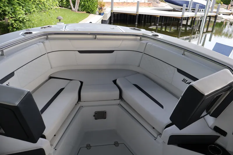 Slide: The Image of 2021 Blackfin 272 CC boat interior with cushioned seating and sleek design. - 38