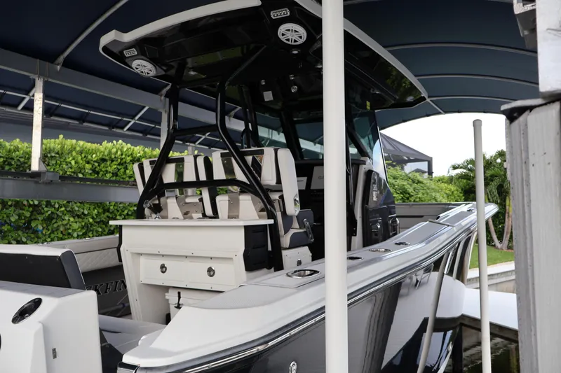 Slide: The Image of 2021 Blackfin 272 CC boat under canopy, showcasing sleek design and modern features. - 41