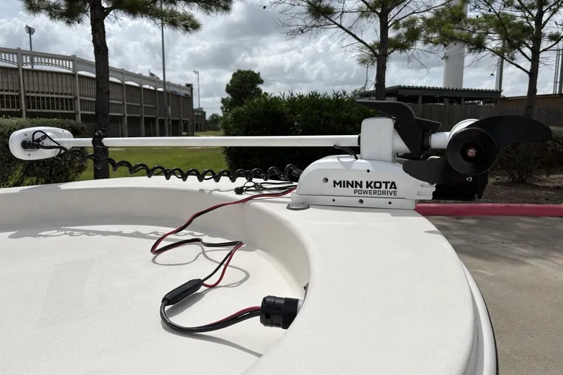 Slide: The Image of 2024 Carolina Skiff E18 JVX CC with Minn Kota PowerDrive trolling motor. - 2