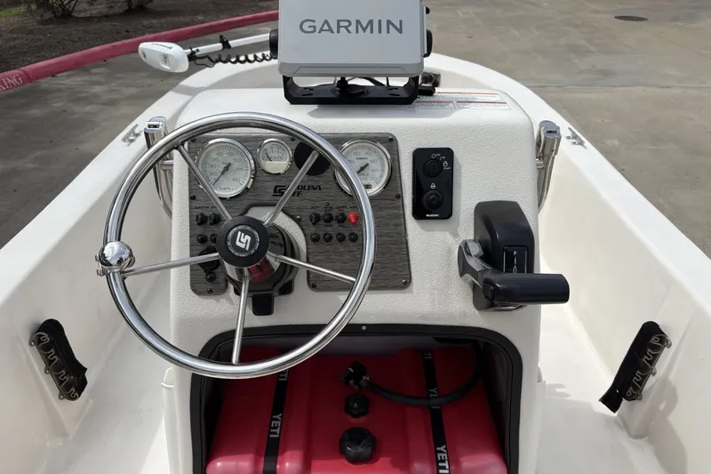 Slide: The Image of 2024 Carolina Skiff E18 JVX CC boat dashboard with Garmin navigation system. - 5
