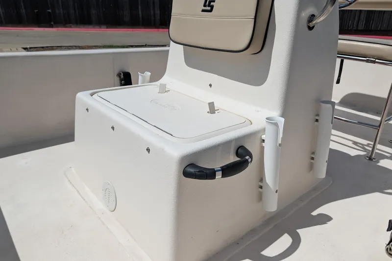 Slide: The Image of 2024 Carolina Skiff E18 JVX CC boat console with storage and rod holders. - 8