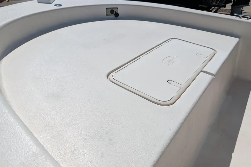 Slide: The Image of 2024 Carolina Skiff E18 JVX CC boat deck with storage compartment. - 9