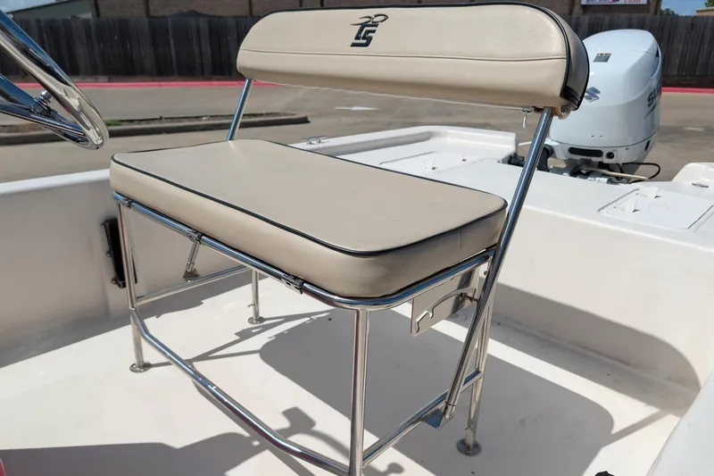 Slide: The Image of 2024 Carolina Skiff E18 JVX CC boat seat with chrome frame and beige upholstery. - 10