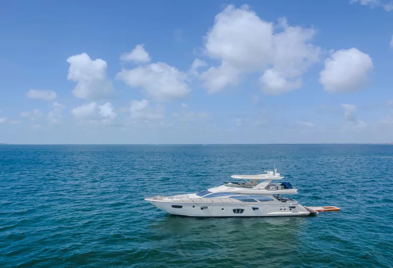 Slide: The Image of 2008 Azimut Flybridge yacht on open sea under blue sky. - 13