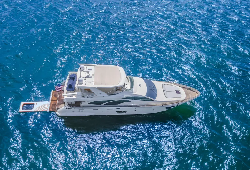 Slide: The Image of 2008 Azimut Flybridge yacht cruising on clear blue ocean waters. - 14