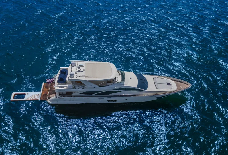 Slide: The Image of 2008 Azimut Flybridge yacht cruising on sparkling blue water. - 15