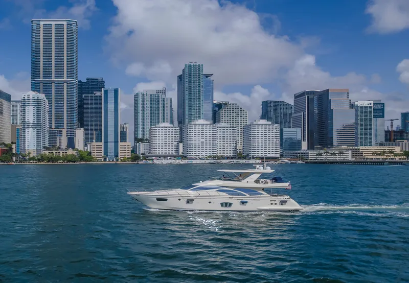 Slide: The Image of Azimut Flybridge 2008 yacht cruising near city skyline on a sunny day. - 26