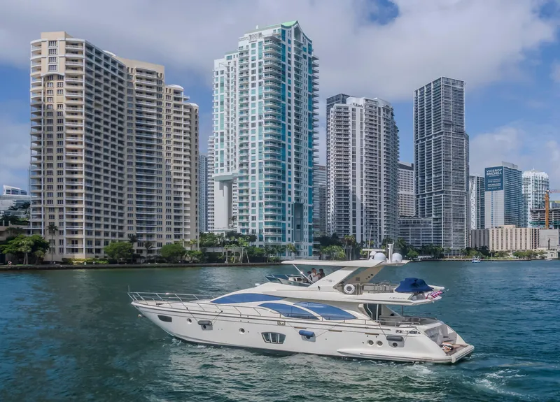 Slide: The Image of 2008 Azimut Flybridge yacht cruising near city skyscrapers on a sunny day. - 41