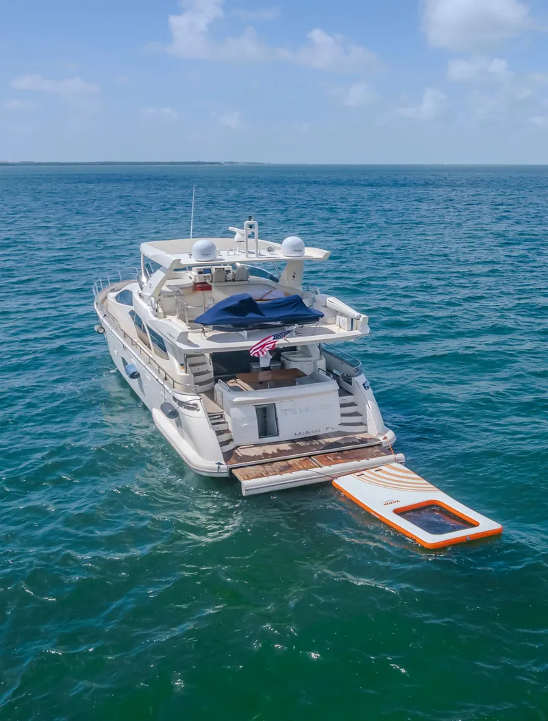 Slide: The Image of 2008 Azimut Flybridge yacht on open sea with swim platform extended. - 7