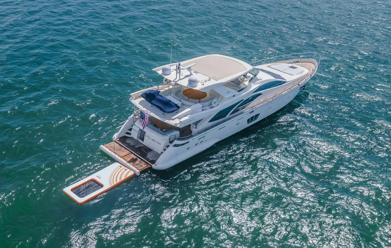Slide: The Image of 2008 Azimut Flybridge yacht cruising on open water, aerial view. - 8