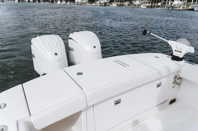 Slide: The Image of 2025 Regulator 28 boat with dual Yamaha engines on water. - 14