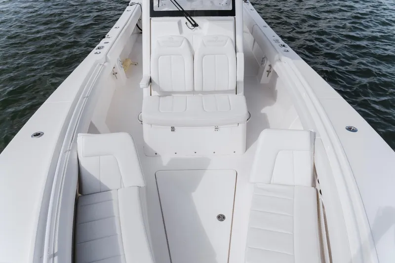 Slide: The Image of 2025 Regulator 28 boat interior with white seating on water. - 17