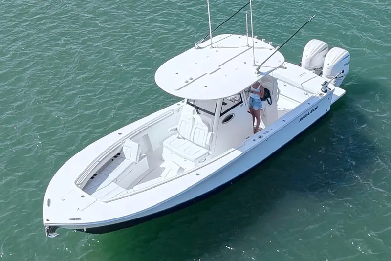 Slide: The Image of 2025 Regulator 28 boat on water, featuring dual engines and spacious deck. - 4