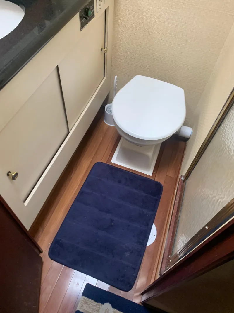 Slide: The Image of Compact bathroom in a 1985 Ocean Yachts 55 Super Sport boat. - 41