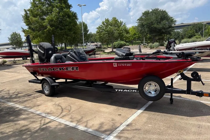 Slide: The Image of Red 2026 Tracker Pro Team 190 TX boat on trailer in parking lot. - 6