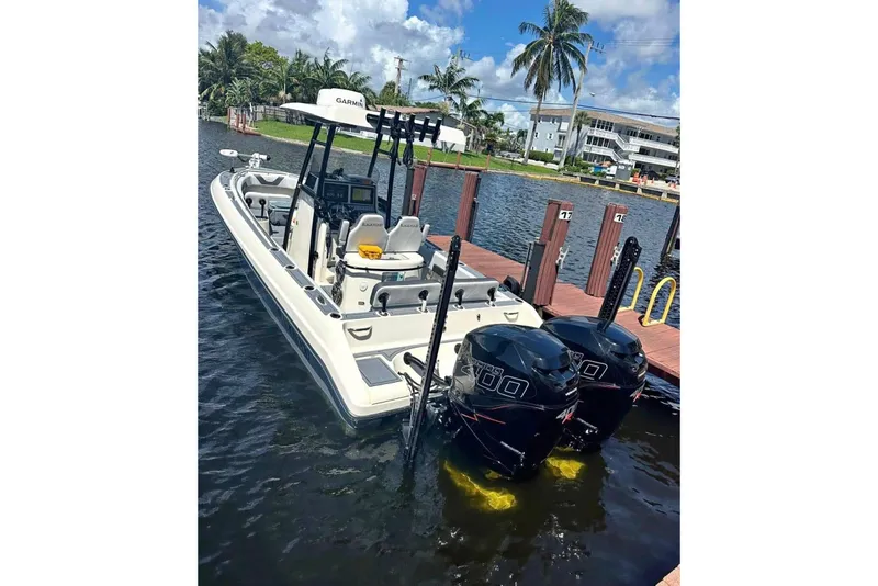 Slide: The Image of 2020 Blackwood 270 LXF boat docked, featuring dual outboard engines and modern navigation equipment. - 1