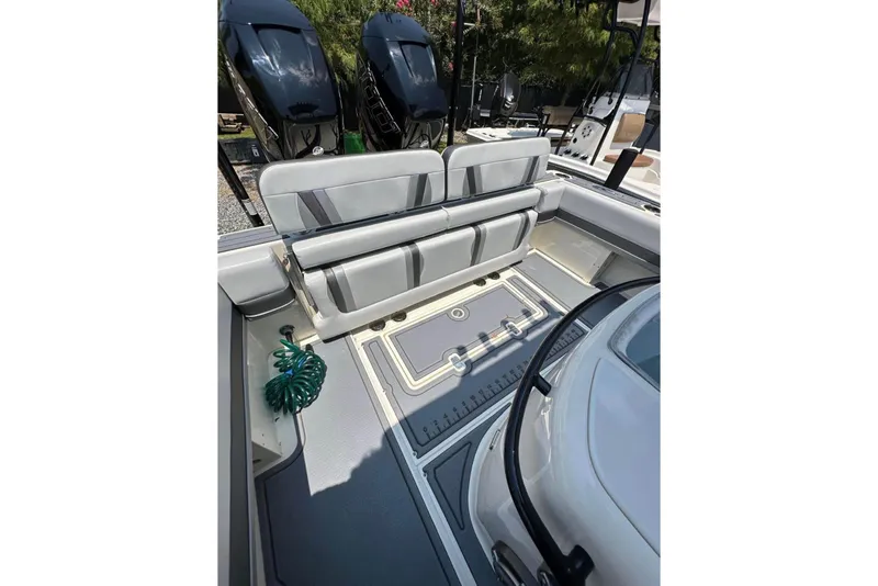 Slide: The Image of 2020 Blackwood 270 LXF boat interior with seating and dual outboard motors. - 10