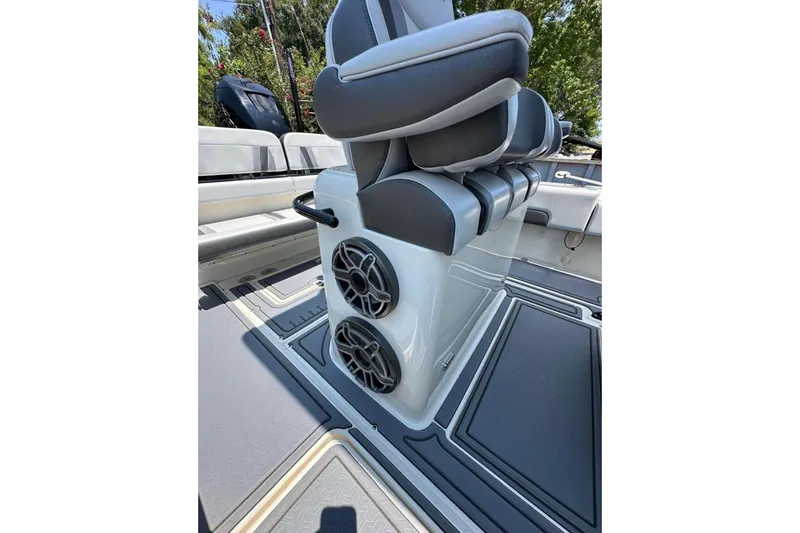 Slide: The Image of 2020 Blackwood 270 LXF boat interior with cushioned seating and dual speakers. - 14
